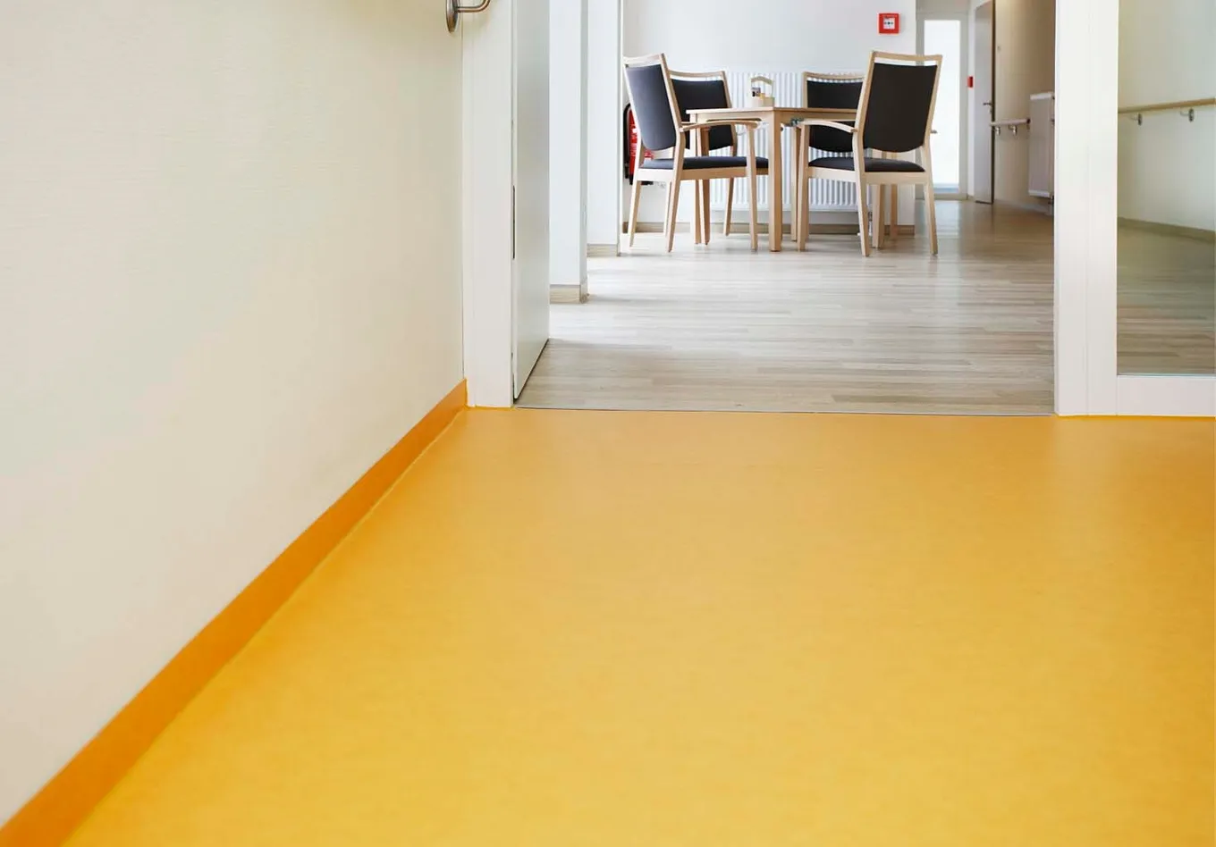 wineo PURLINE Bioboden Orange Holzoptik Flur